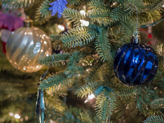 Obraz na płótnie Canvas Closeup of various Christmas decorations, santa, rudolph, holiday, macro, christmas village, christmas figurines.