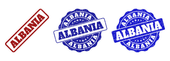 ALBANIA scratched stamp seals in red and blue colors. Vector ALBANIA signs with dirty texture. Graphic elements are rounded rectangles, rosettes, circles and text titles.