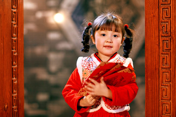 Cute girl with a red envelope