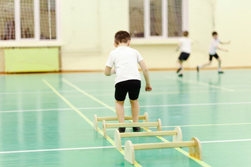 child jumps in the gym