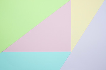 Obraz premium Fashionable pastel colored paper flat lay top view, geometric background texture, pink, purple, yellow, beige, green and blue.