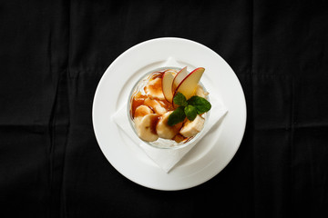 Top view ice cream dessert banana apple in glass