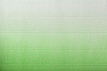 Texture of corrugated green and white paper with gradient
