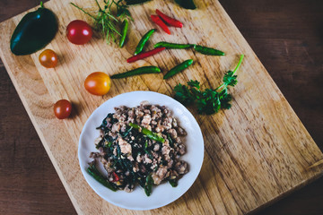 Pat-Ka-Praw-Moo Thai street food.Hot and Spicy pork chop and basil fried.