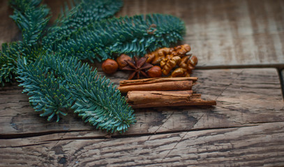 green fir branches on the background of boards
