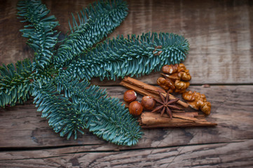 green fir branches on the background of boards
