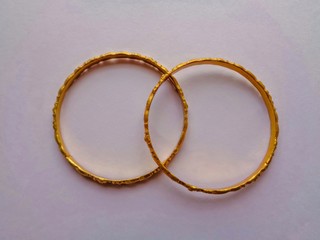 Golden weeding bangles isolated on white background