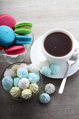 A cup of coffee and macaroons ready for breakfast