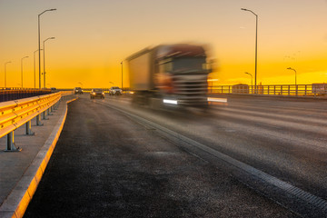 truck on the highway at sunset
