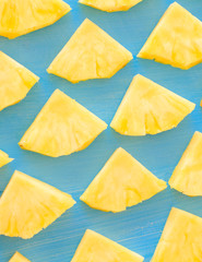 pattern of Sweet pineapple on blue background top view, flat lay