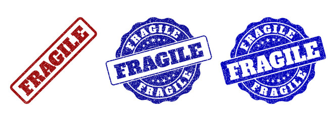 FRAGILE scratched stamp seals in red and blue colors. Vector FRAGILE labels with distress surface. Graphic elements are rounded rectangles, rosettes, circles and text labels.