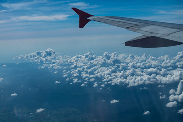 Clouds seen from an airplane, blue sunshine, soil background nature landscape