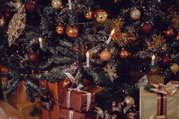 Fototapeta na wymiar Christmas tree close-up on beautiful expensive brown wooden