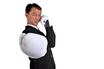 Businessman wearing boxing gloves acting  punching like business have competition all time