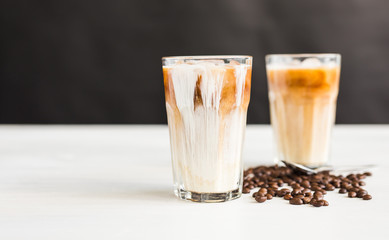 Delicious drink concept - Iced coffee in a glass with ice.
