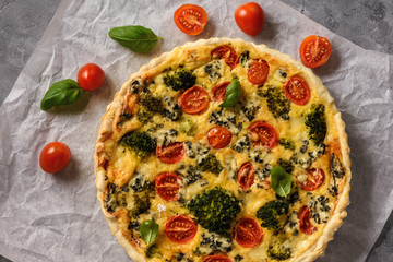 Homemade tart with broccoli, tomatoes and blue cheese.
