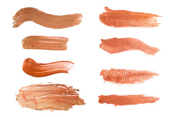 Set of shiny beige brush strokes of acrilic or oil paint isolated on white