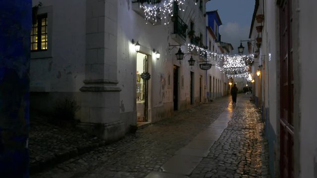 OBIDOS, PORTUGAL - NOVEMBER 20, 2018: Night view of the small streets of the village of Obidos, Portugal