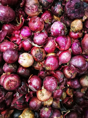 Shallots background texture. Pile of shallot in fresh market. Shallot is herb vegetable ingredient.