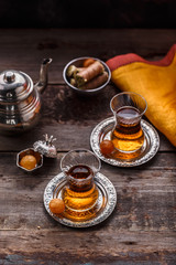 Turkish tea in traditional cups with teapot, copy space