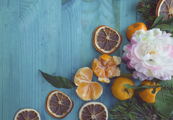 festive frame with flower and mandarines