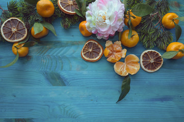 citrus fruits and peony flower arrangement
