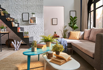Decorative middle table close up concept. Loft home style with black stairs room.
