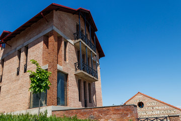 Facade of modern brick house at sunny day