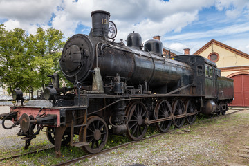 Naklejka premium Hundred year old black steam locomotive