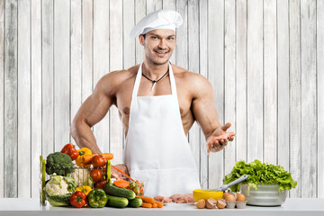 Man bodybuilder on kitchen