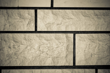 Wall of artificial brick background. Toned
