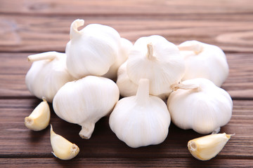 Fresh garlic on a brown wooden background