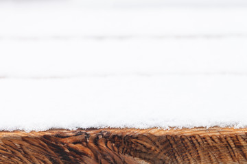 Snow on boards of a wooden bench. New year and christmas theme