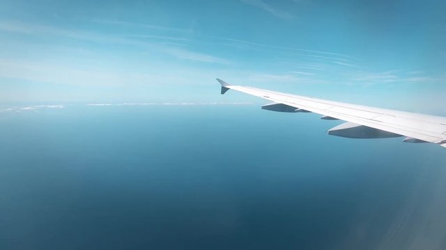 Footage of a passenger plane in flight, taken from inside the cabin.