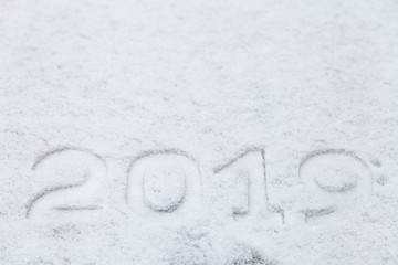 Figures 2019 on the snow. New year and christmas theme