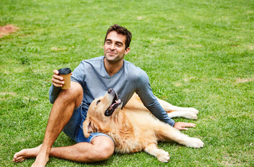 Handsome dude with his dog in park