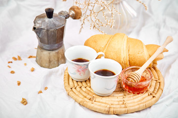 Good morning. Two cup of coffee with croissant and jam.