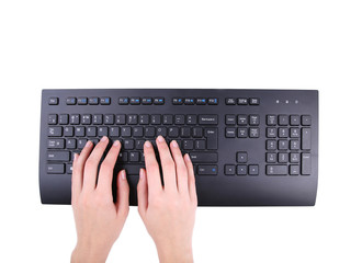 Female hands or woman office worker typing on the black keyboard. Isolated on white background