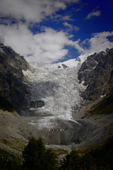 Fantastic glacier mountains in the beautiful cumulus