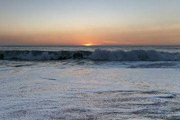 Sunset in Atlantic ocean, Nazare, Portugal.