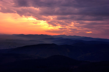Obraz na płótnie Canvas Mountains silhouettes at sunset.