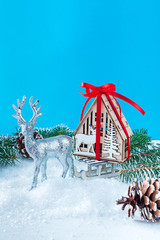 Santa's Christmas deer is carrying a sleigh with a gift house. A symbol of dreaming and dreaming,...