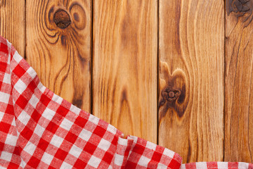 Fototapeta premium checkered tablecloth on wooden table
