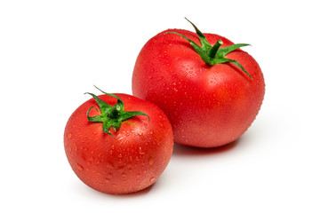 Tomatoes isolated on white background. Two fresh raw vegetables