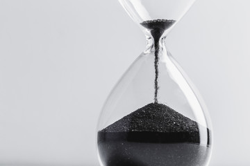 Close up hourglass on table