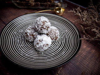 Healthy organic date energy balls with coconut flakes, dried fruits and nuts. Food for healthy lifestyle.