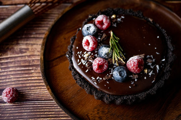 Tart Chocolate cheesecake with fresh berries. delicious dessert for Birthday.