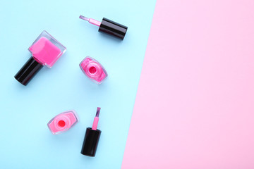 Group of pink nail polishes on colorful background