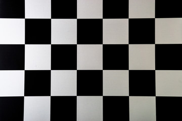 Chess board closeup background. Selective focus and crop fragment