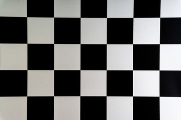 Chess board closeup background. Selective focus and crop fragment